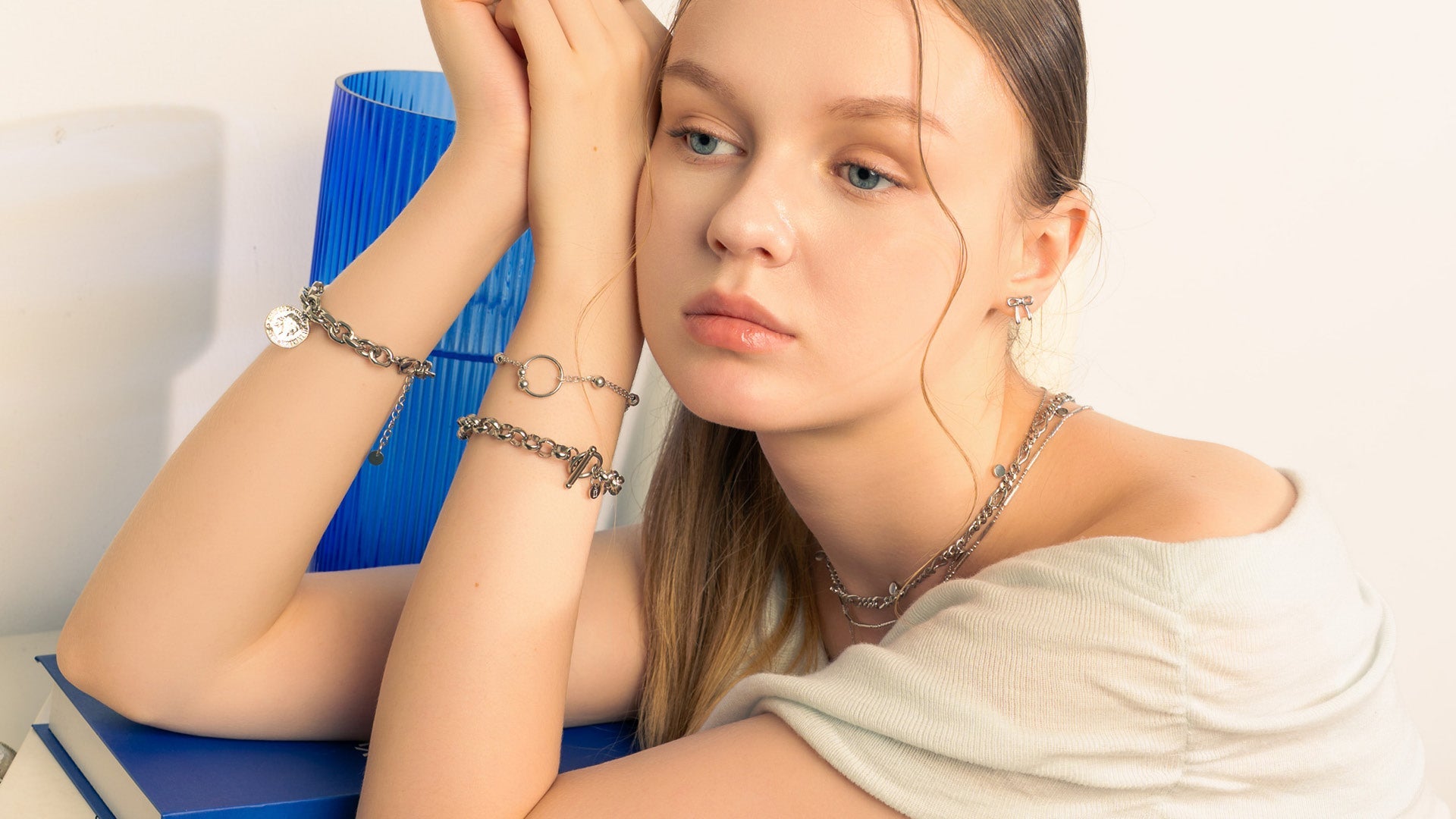 LAVANA chain bracelets collection showcasing elegant gold and silver designs on white background