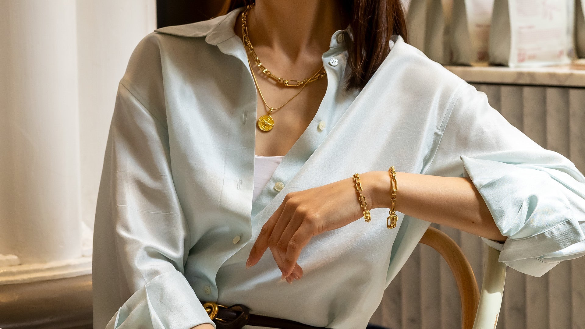 LAVANA charm bracelets collection showcasing elegant silver and gold designs on display