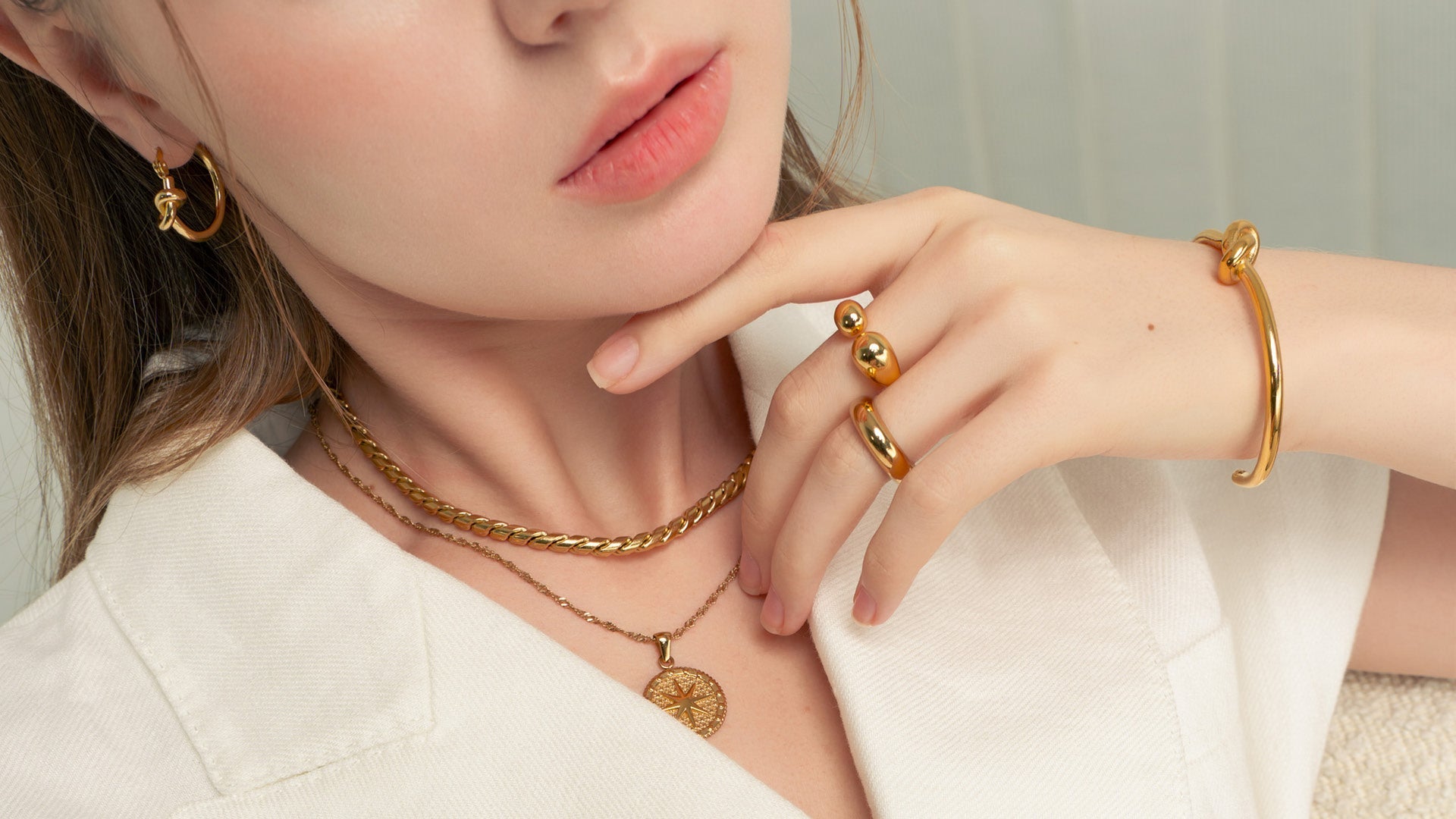 LAVANA pendant necklaces collection showcasing elegant gold and silver designs on white background