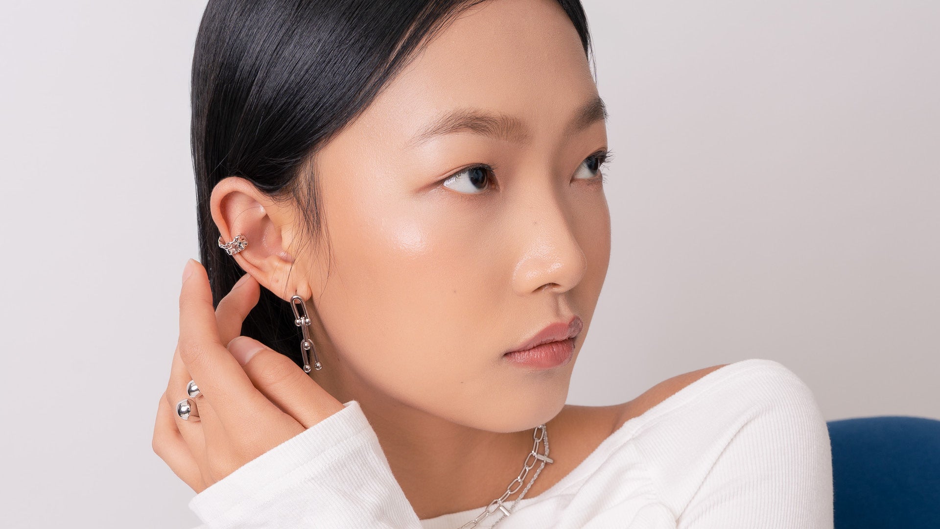 LAVANA elegant silver earrings displayed in a lifestyle shot showcasing modern jewellery style