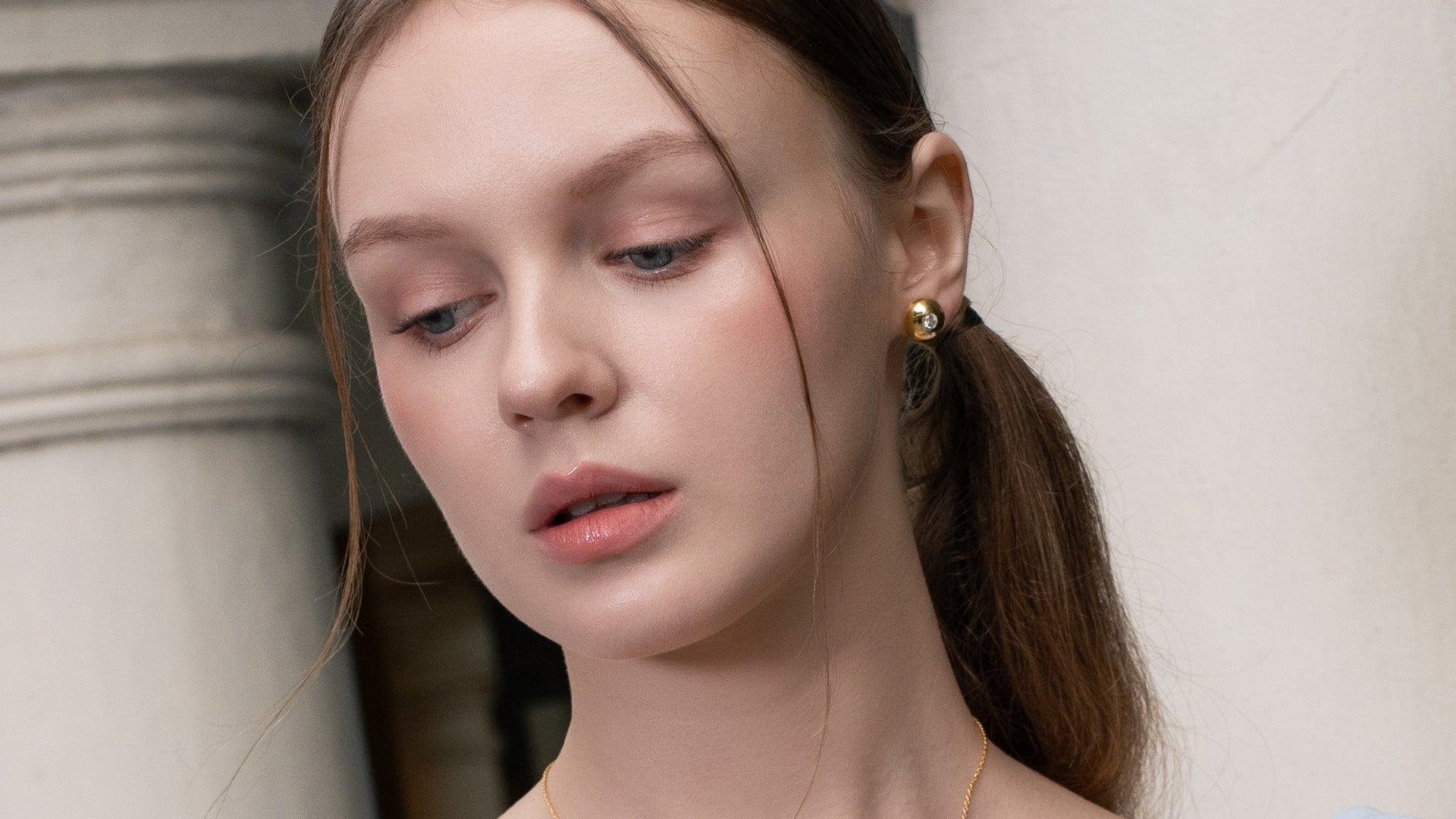 LAVANA stud earrings collection featuring elegant gold and silver designs on white background