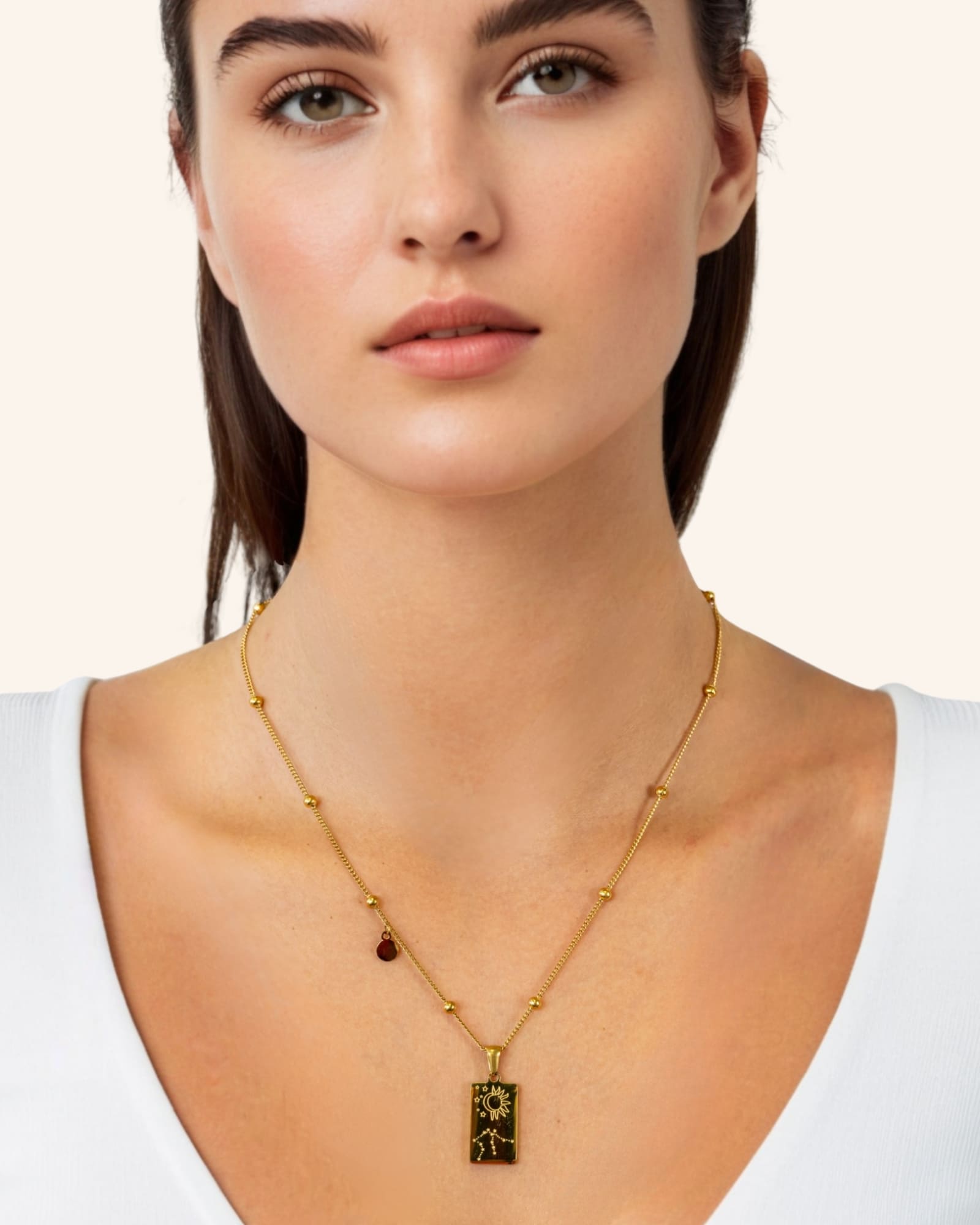 Aquarius Gold Zodiac Tag Necklace by Lavana, on model engraved tag on beaded chain, back