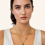 Aquarius Gold Zodiac Tag Necklace by Lavana, on model engraved tag on beaded chain, front