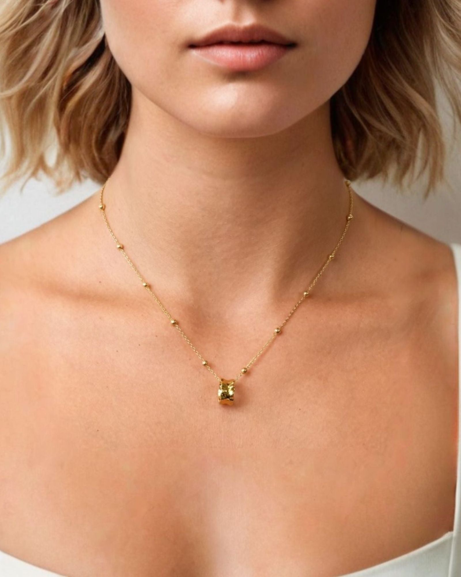 Aria Gold Pendant by LAVANA on model smooth molten gold look pendant