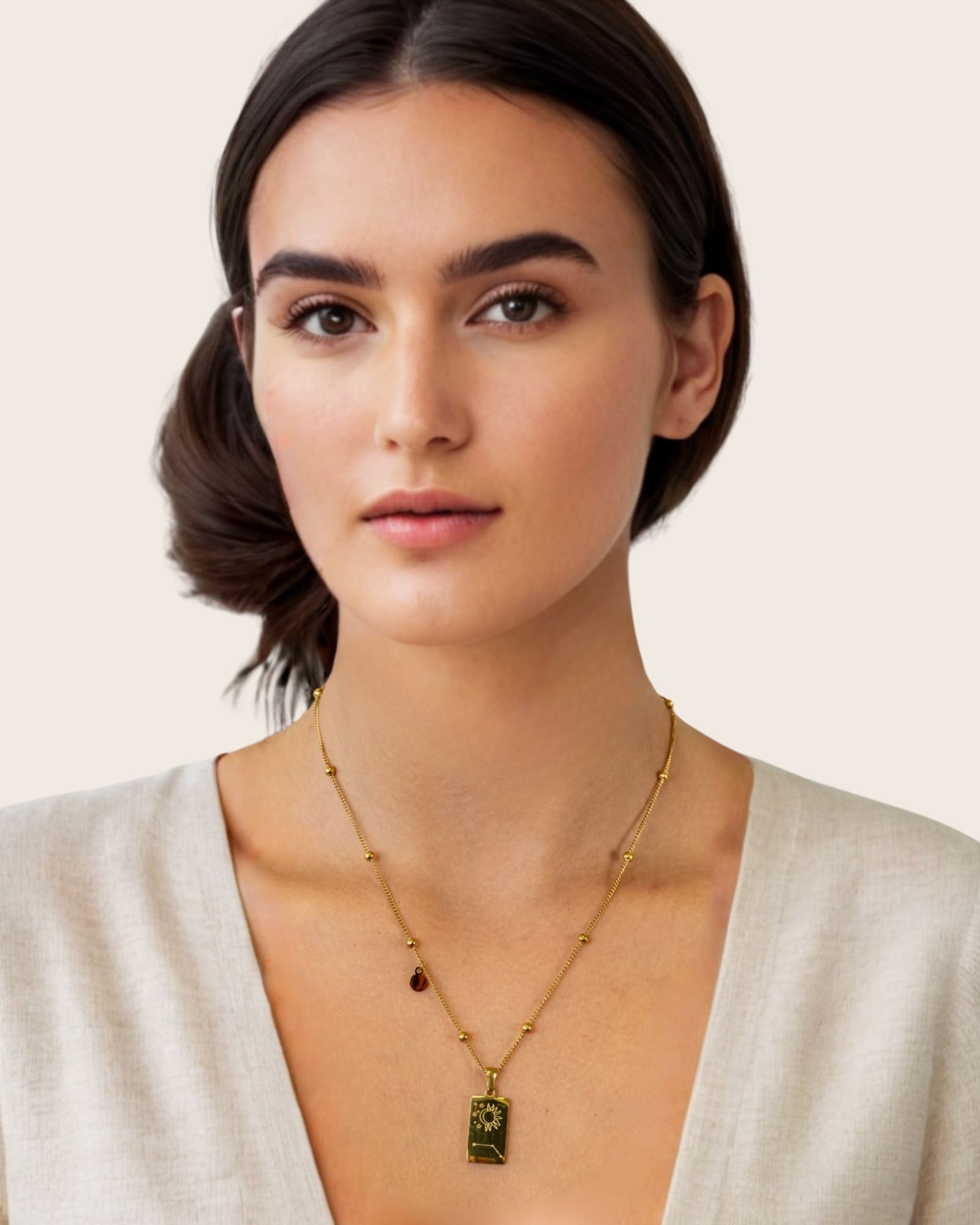 Aries Gold Zodiac Tag Necklace by Lavana, on model engraved tag front and back on beaded station chain, back