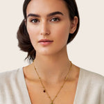 Aries Gold Zodiac Tag Necklace by Lavana, on model engraved tag front and back on beaded station chain, back