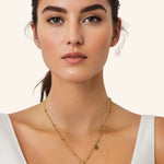 Aries Gold Zodiac Tag Necklace by Lavana, on model engraved tag front and back on beaded station chain, front