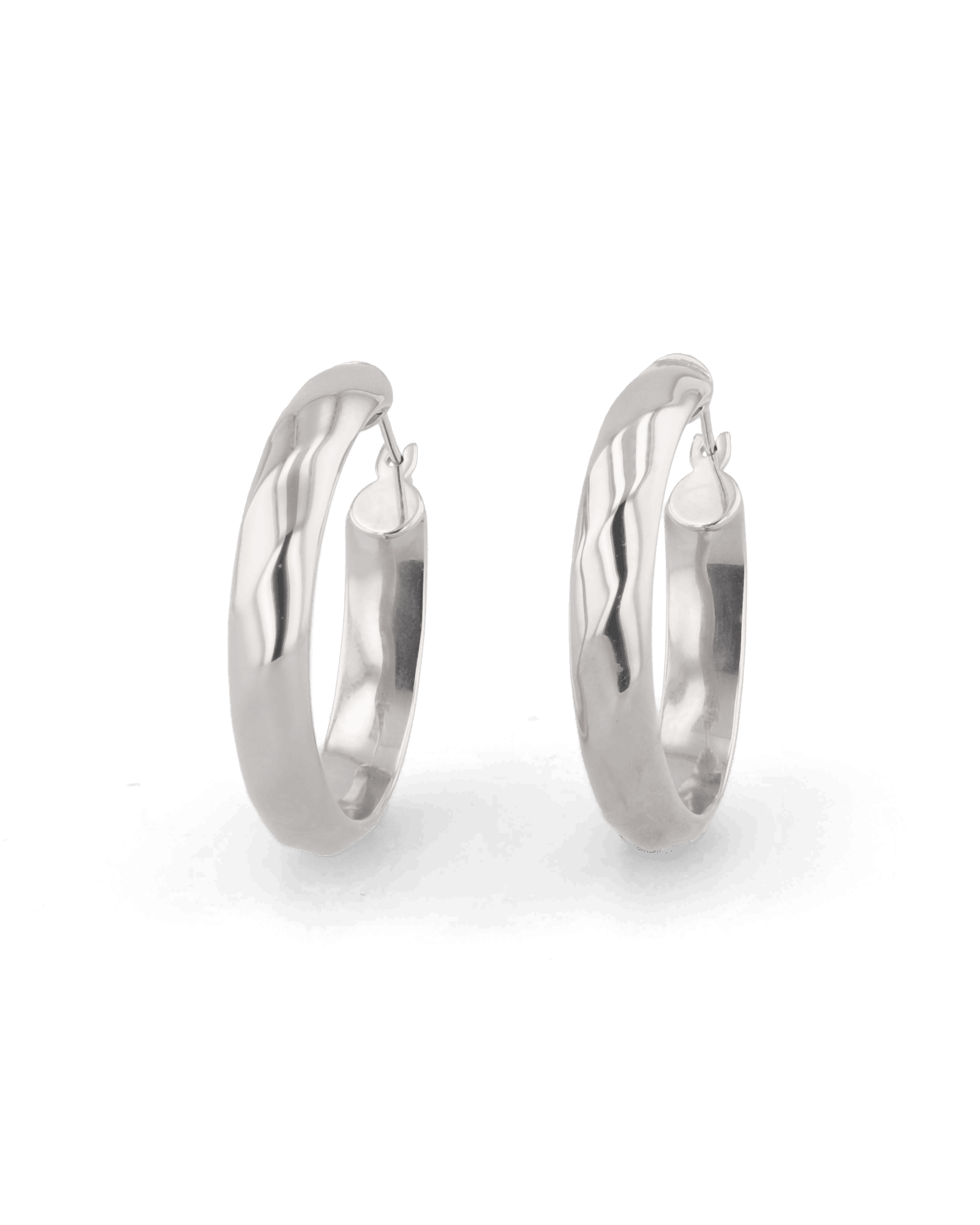 Aura Silver Hoop Earrings by Lavana, medium width hoops with angled light catching detail