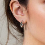 Aura Silver Hoop Earrings Small by Lavana on model wide medium hoops with angled light catching detail