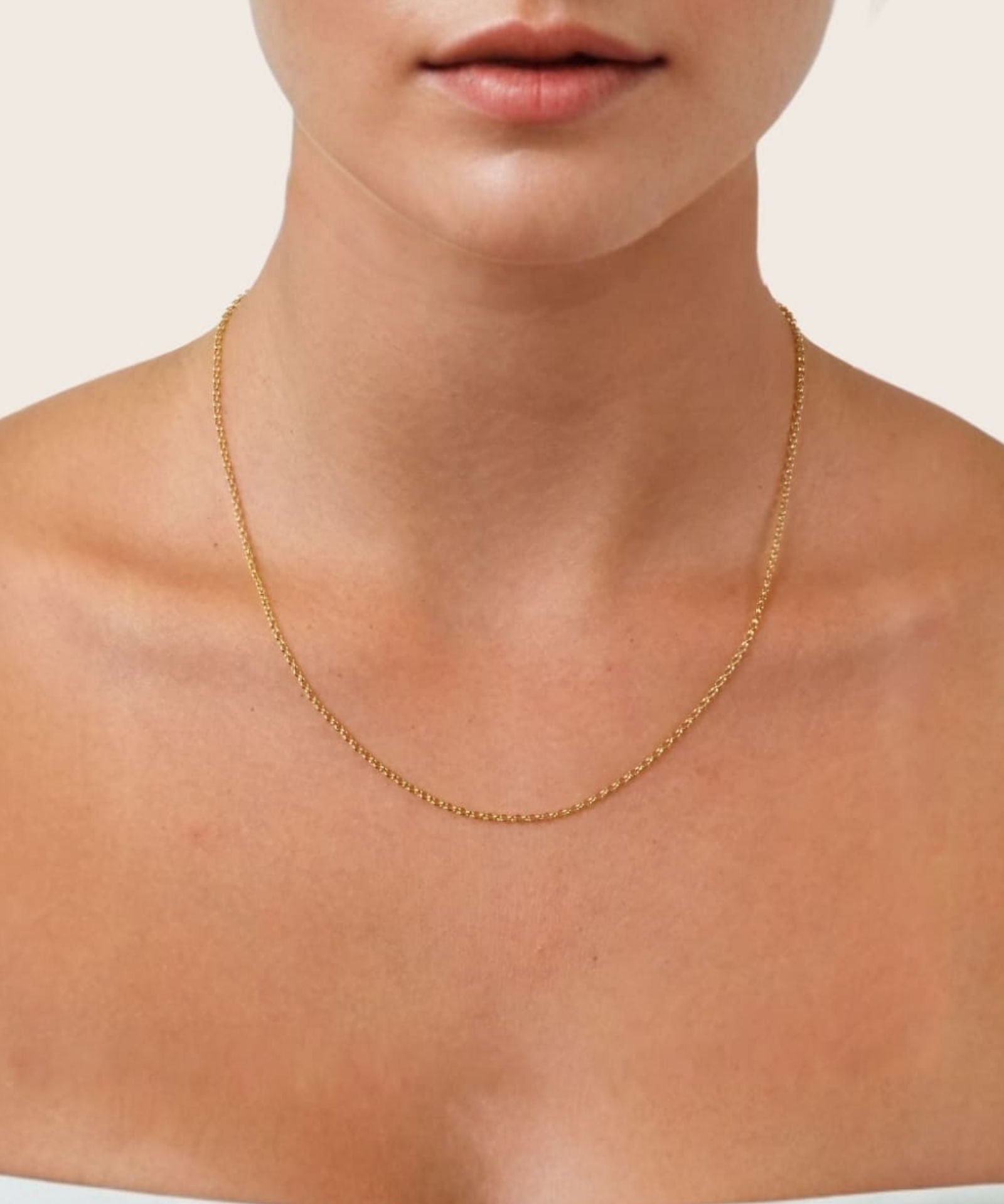 Baby Belcher Gold Chain Necklace by Lavana, on model; medium with fine rounded belcher links