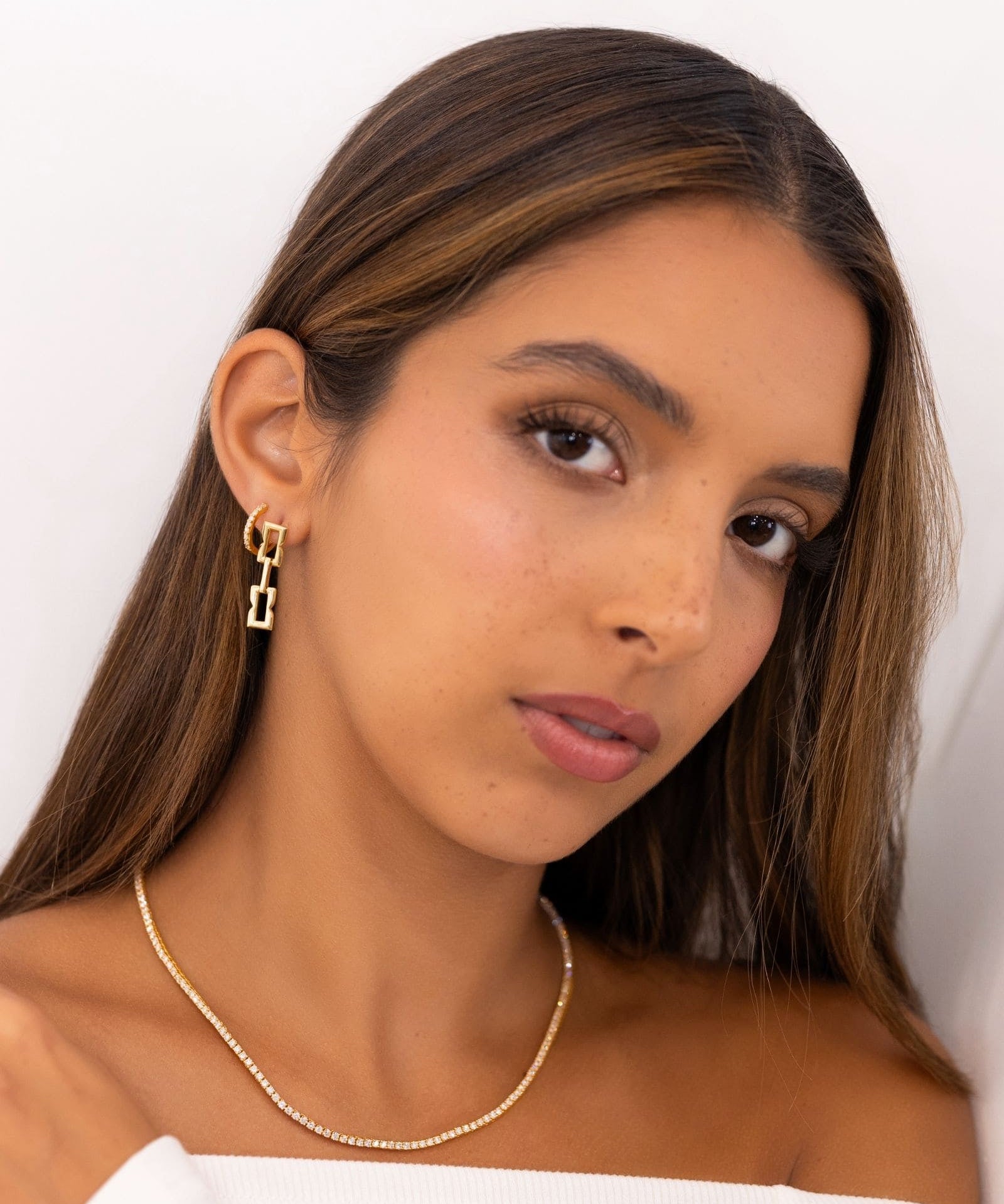Barcelona Gold Diamond Huggie Earrings by Lavana on model 18k gold vermeil hoops with lab grown diamonds