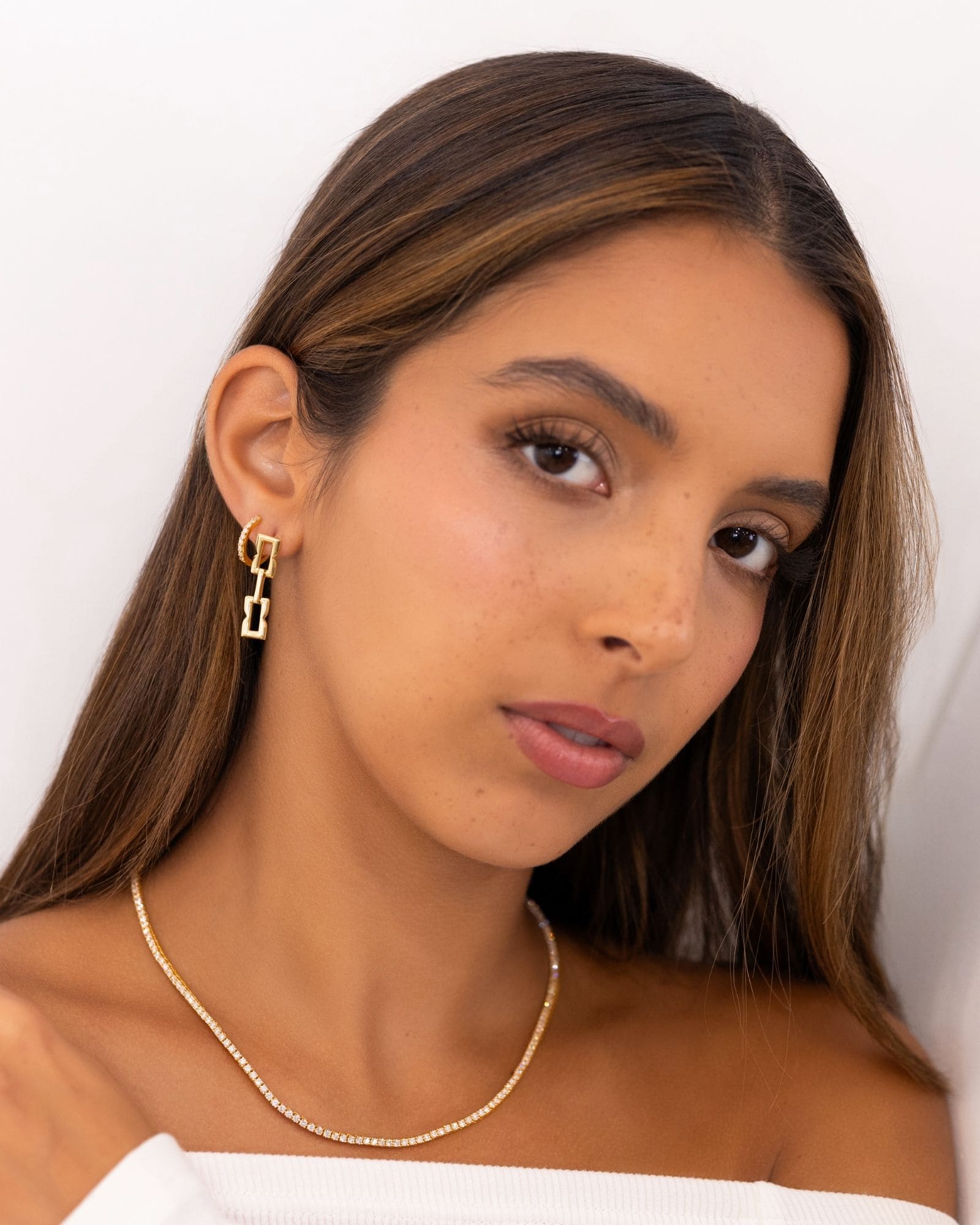 Barcelona Gold Diamond Huggie Earrings by Lavana on model 18k gold vermeil hoops with lab grown diamonds