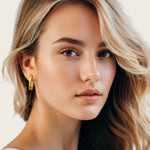 Block Rectangle Gold Hoop Earrings by Lavana, on model; open rectangular hoops with polished domed face