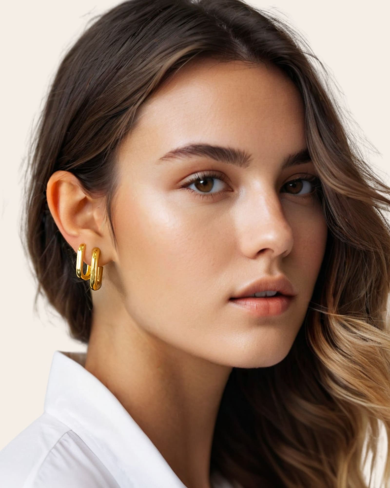 Block Rectangle Gold Hoop Earrings by Lavana, on model; open rectangular hoops with polished domed face