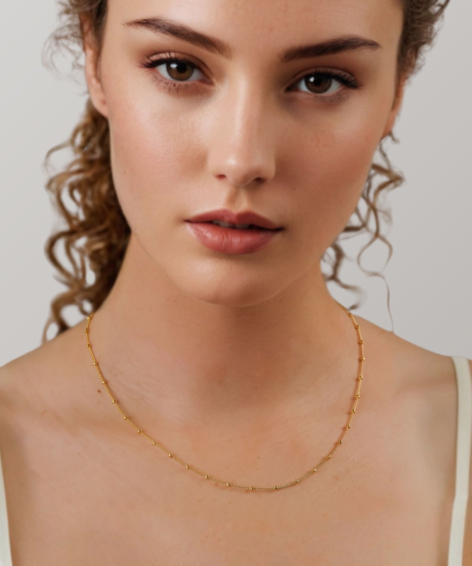 Brooklyn Gold Station Chain Necklace by Lavana on model curb chain with polished bead stations
