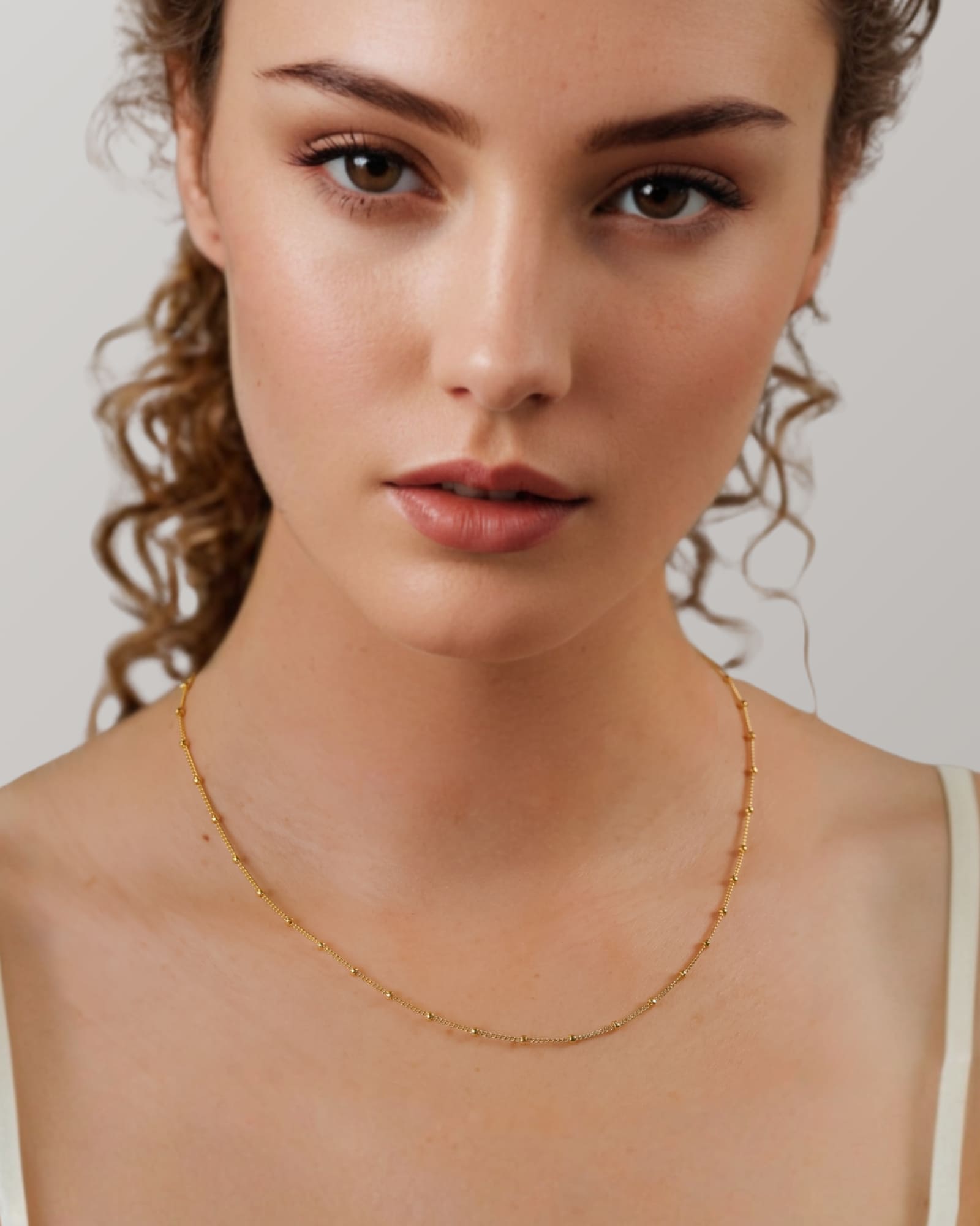 Brooklyn Gold Station Chain Necklace by Lavana on model curb chain with polished bead stations