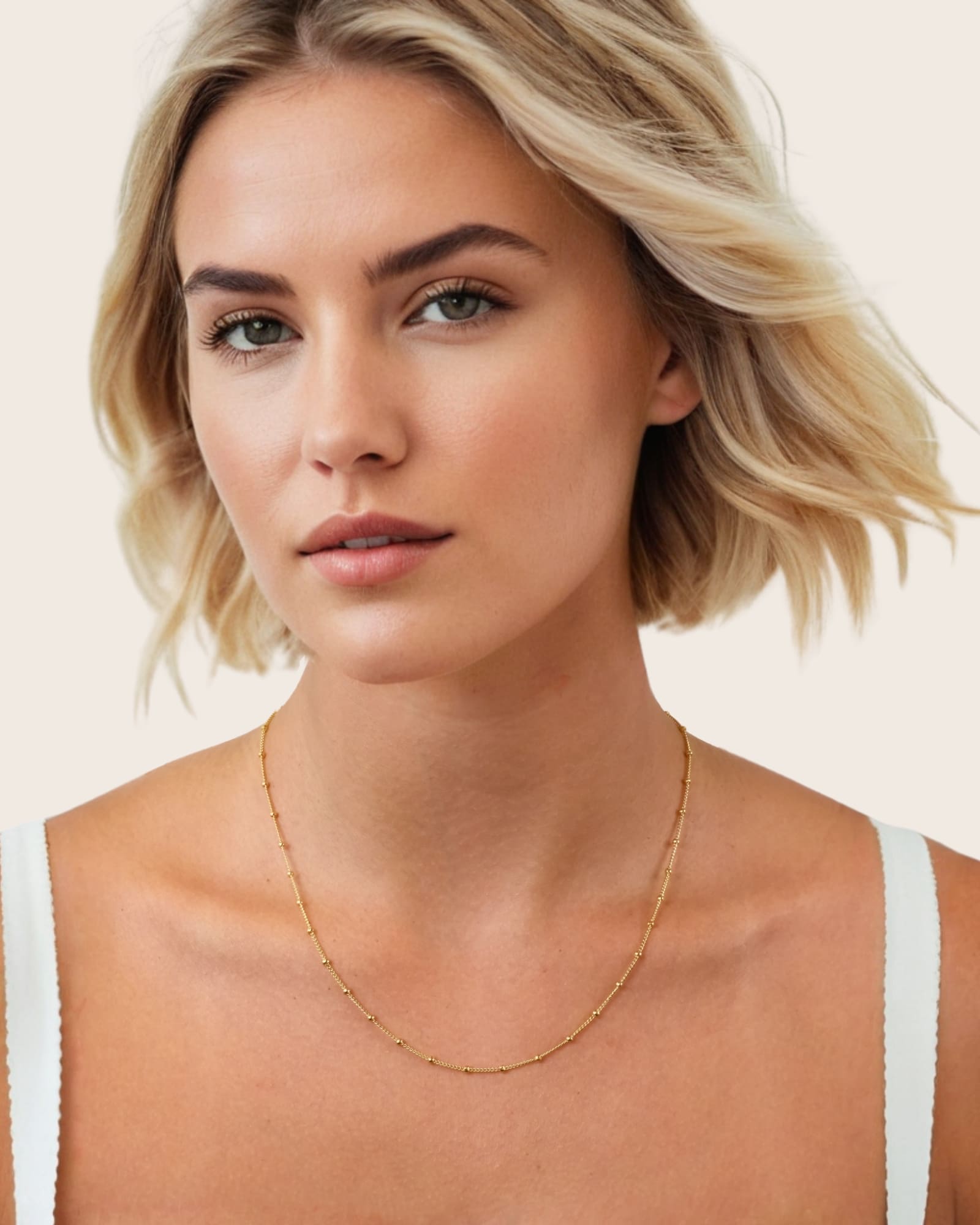 Brooklyn Gold Station Chain Necklace by Lavana, on model; medium curb chain with polished bead stations