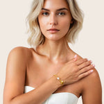 Cadiz Gold Pearl T-Bar Bracelet by Lavana, on model; oval chain with single freshwater pearl and front toggle 