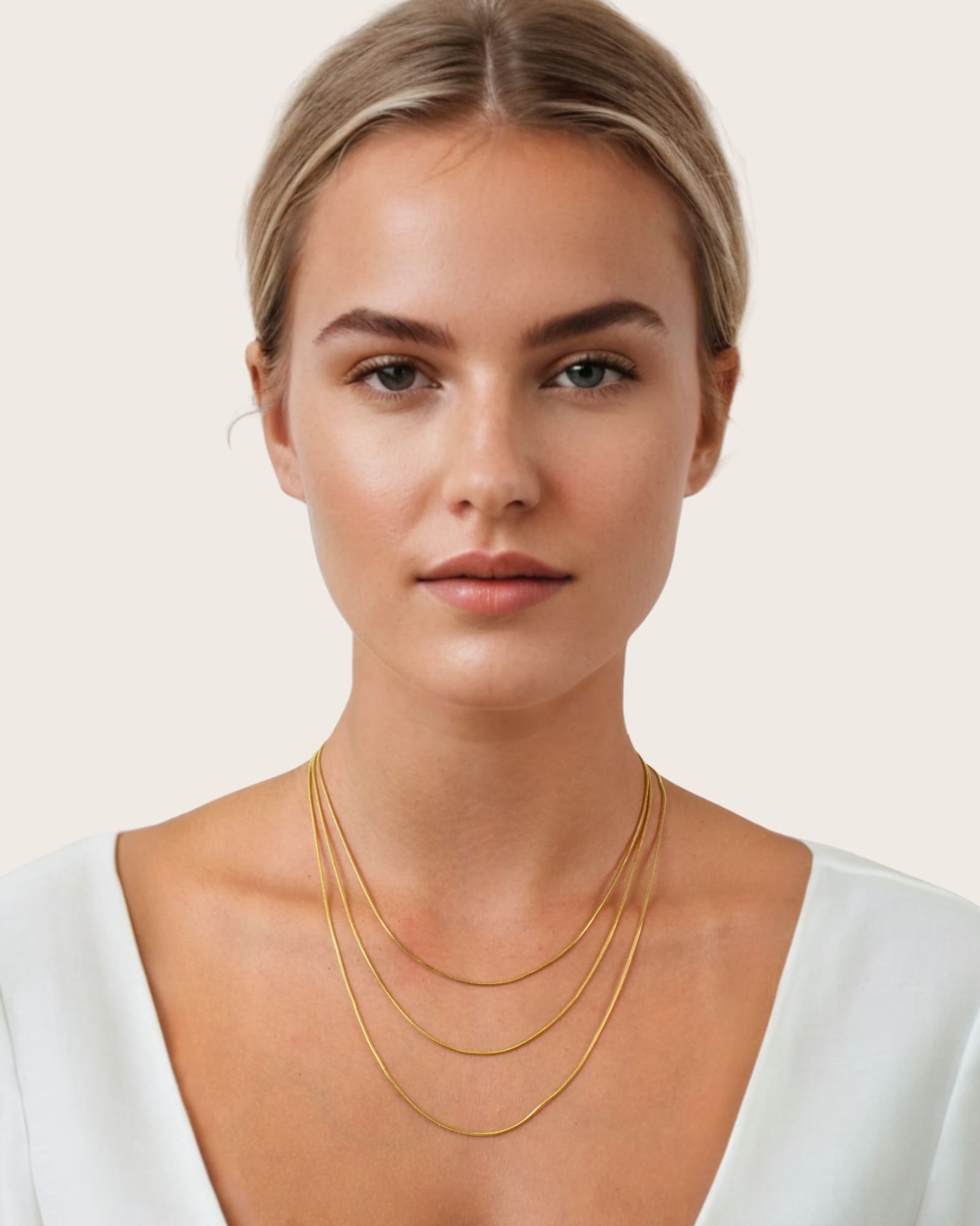 Cali Gold Snake Chain Necklace by Lavana, on model; layered sleek flat snake chain with polished finish