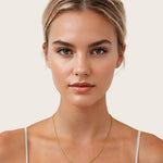 Cali Gold Snake Chain Necklace by Lavana, on model; medium sleek flat snake chain with polished finish 