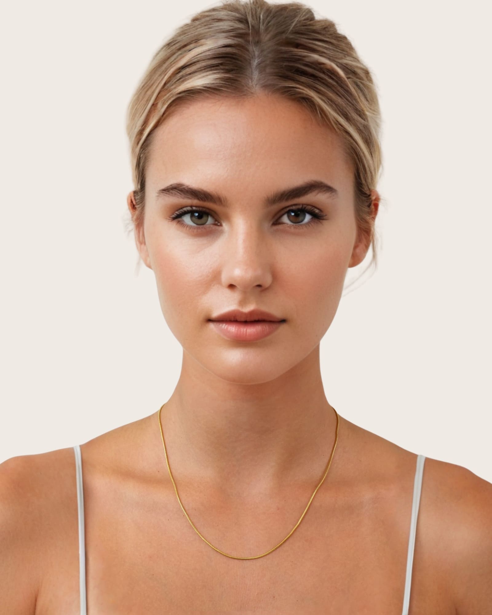 Cali Gold Snake Chain Necklace by Lavana, on model; medium sleek flat snake chain with polished finish 