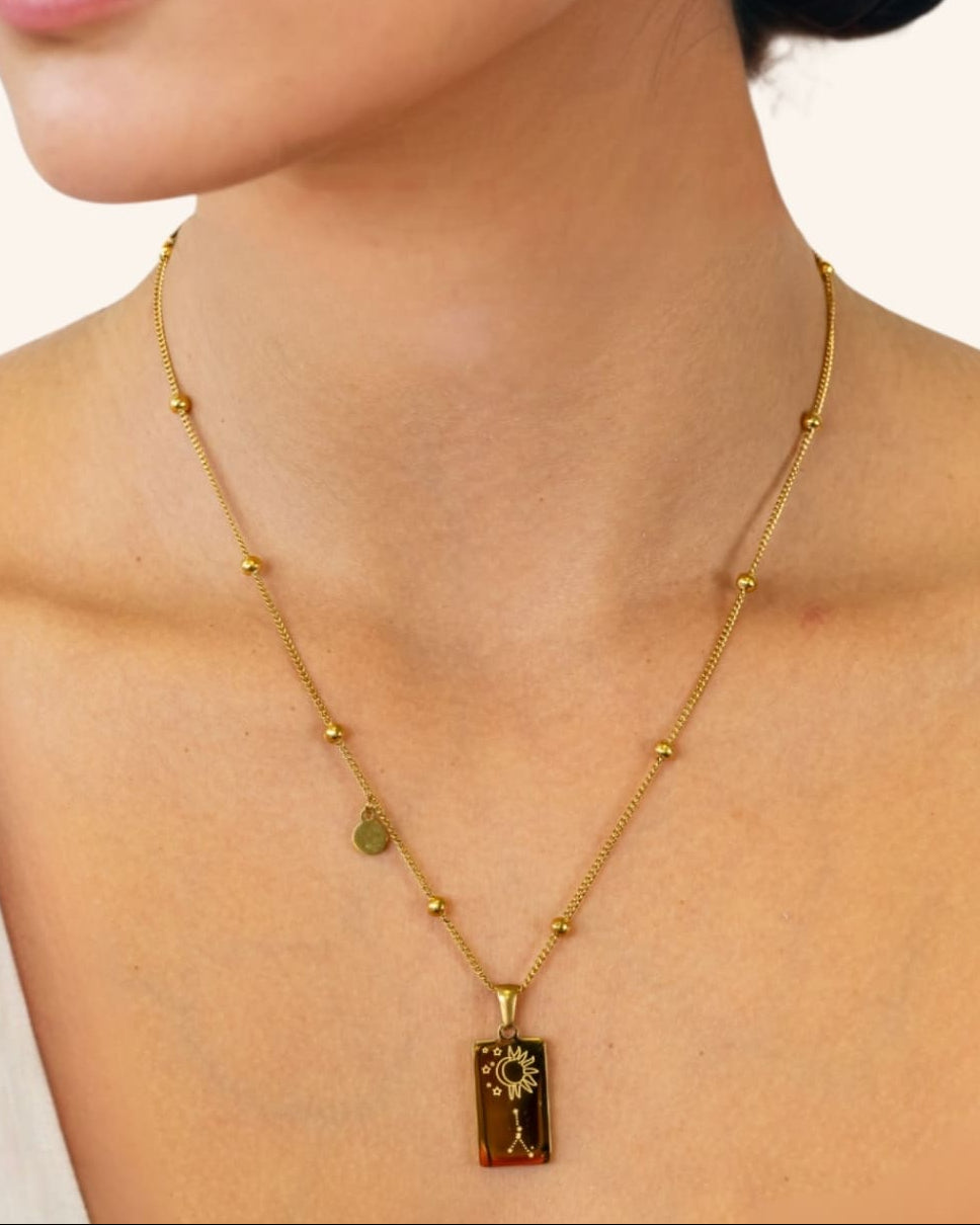 Cancer Gold Zodiac Tag Necklace by Lavana, on model engraved tag with constellation on beaded chain, back