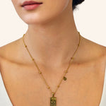 Cancer Gold Zodiac Tag Necklace by Lavana, on model engraved tag with constellation on beaded front