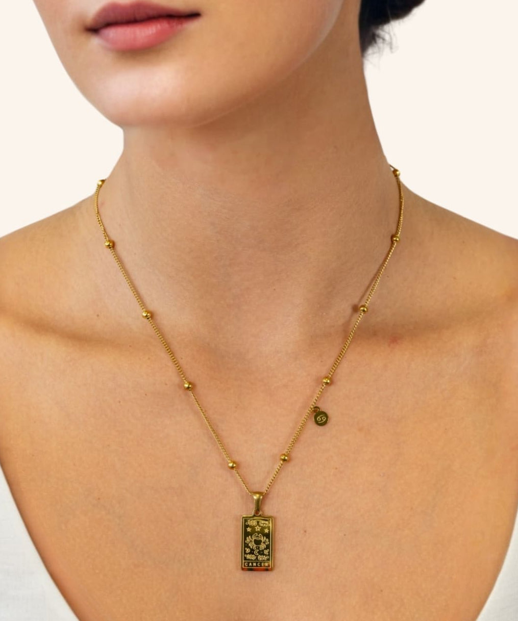 Cancer Gold Zodiac Tag Necklace by Lavana, on model engraved tag with constellation on beaded front