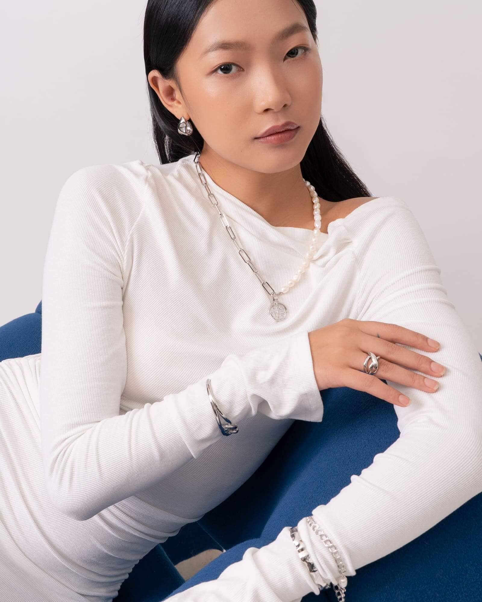 Capri Silver Pearl Necklace by Lavana, on model; modern half paperclip chain half freshwater pearls with coin