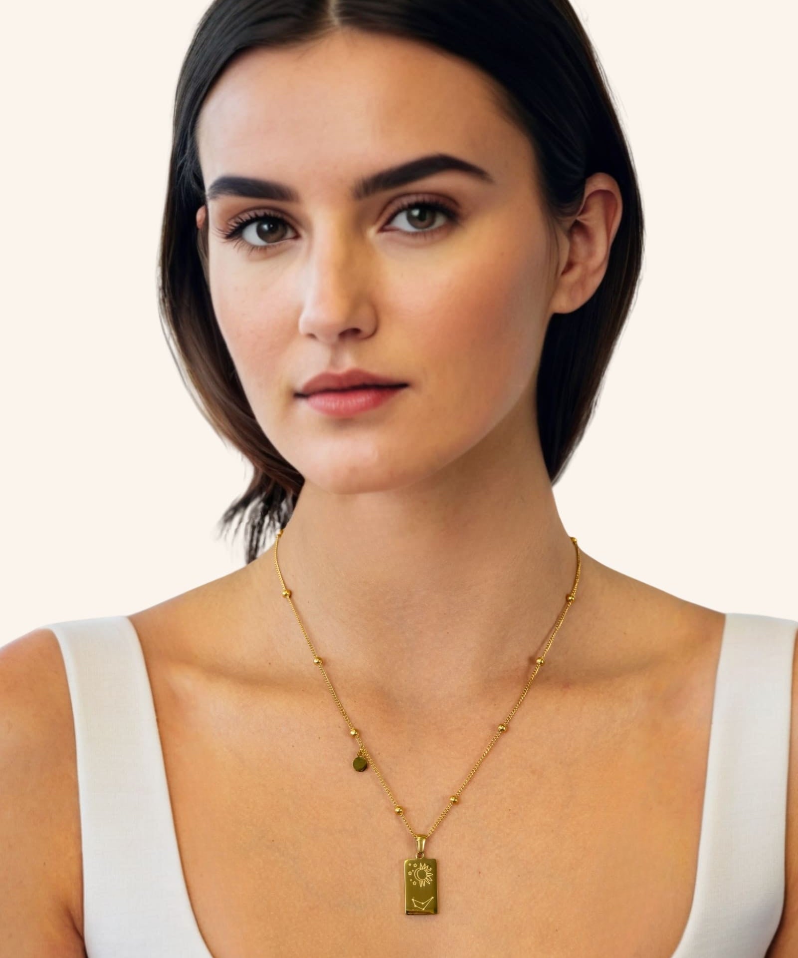 Capricorn Gold Zodiac Tag Necklace by Lavana, on model engraved tag on beaded chain