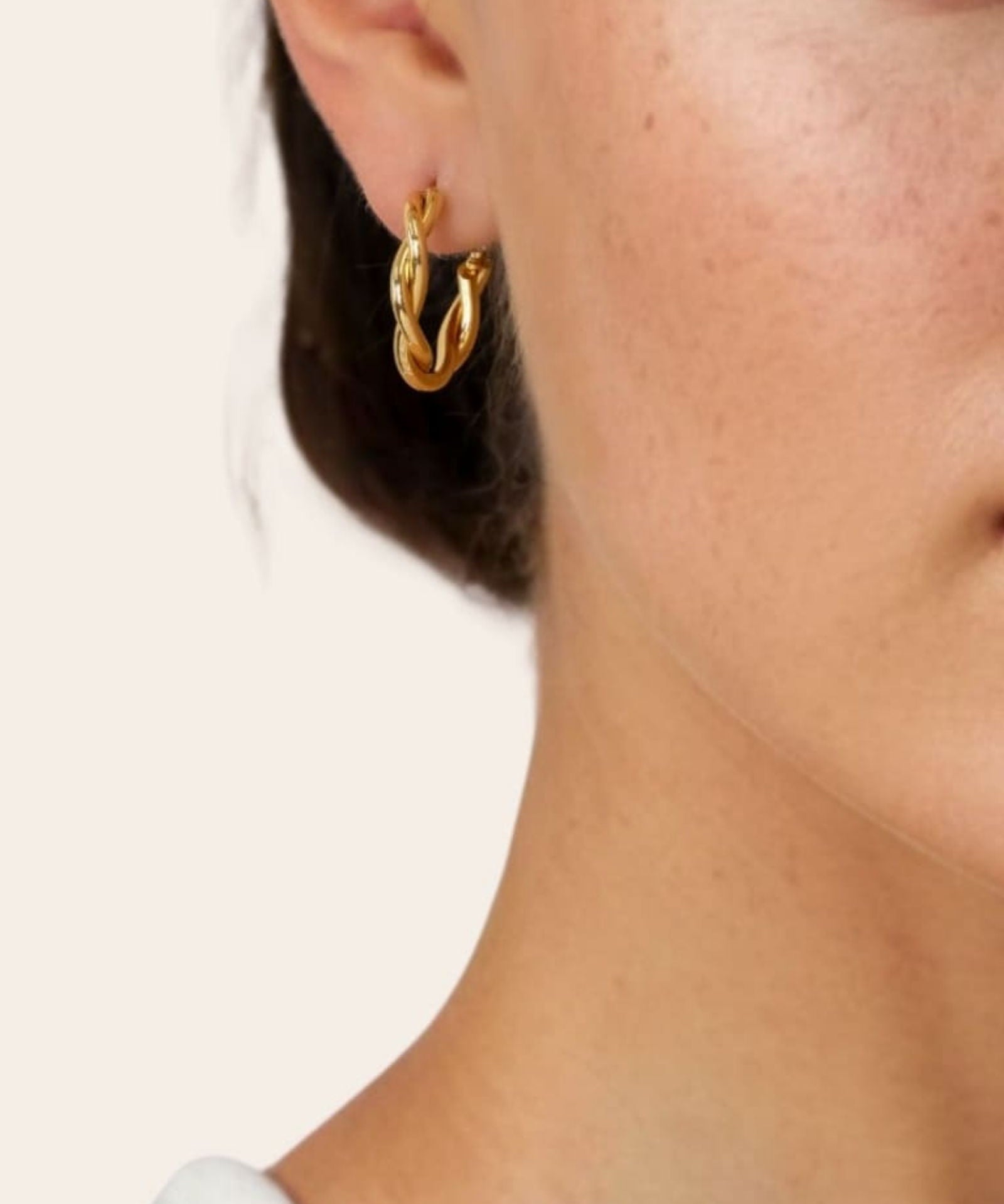 Cascade Gold Hoop Earrings by Lavana on model overlapping arc design with polished finish