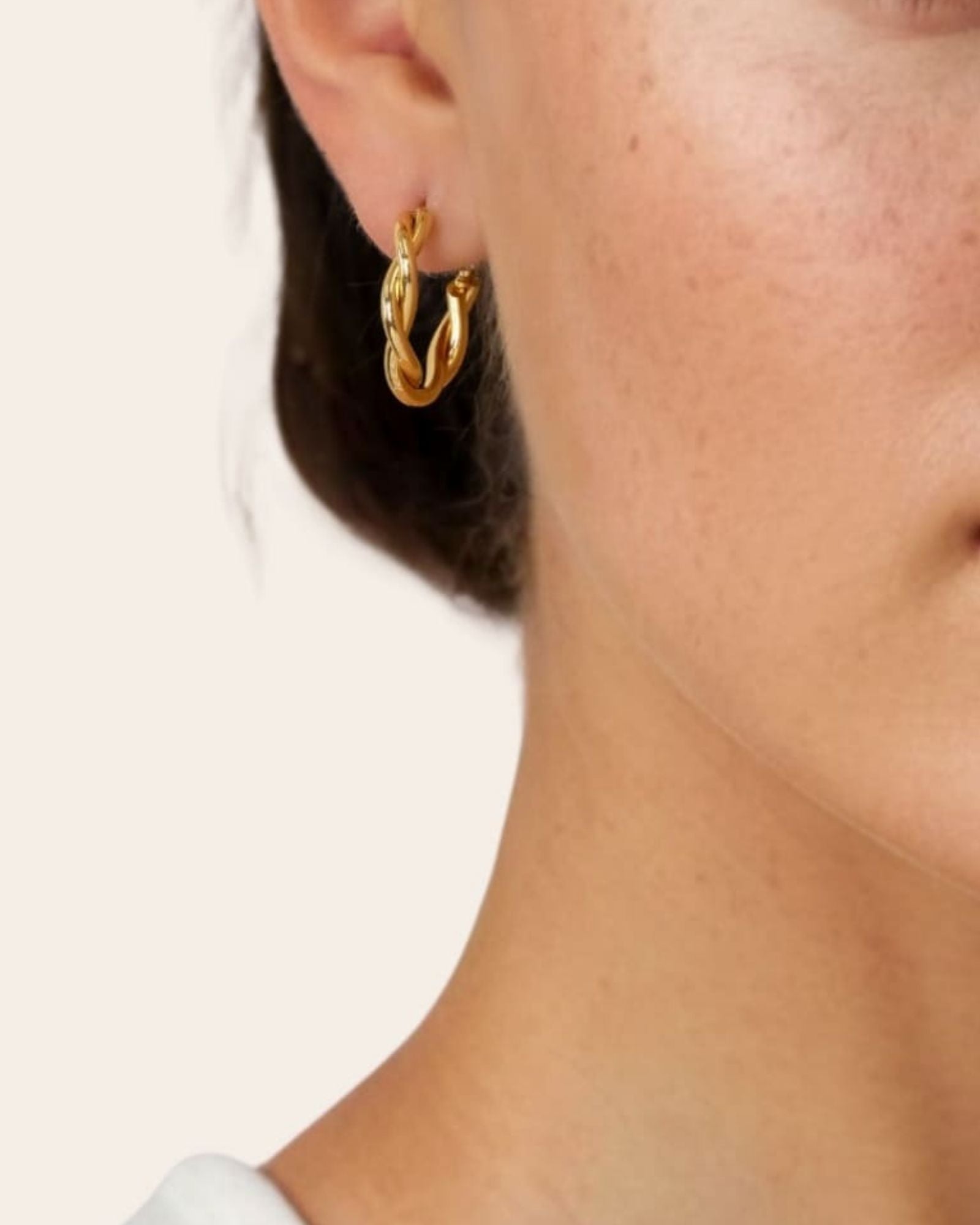 Cascade Gold Hoop Earrings by Lavana on model overlapping arc design with polished finish