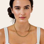 Core gold chain necklace by Lavana, on model with sleek cord style links