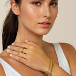 Cuban Duet Gold Bracelet Set by Lavana on model curb chain and smooth bar bracelet with bead accent