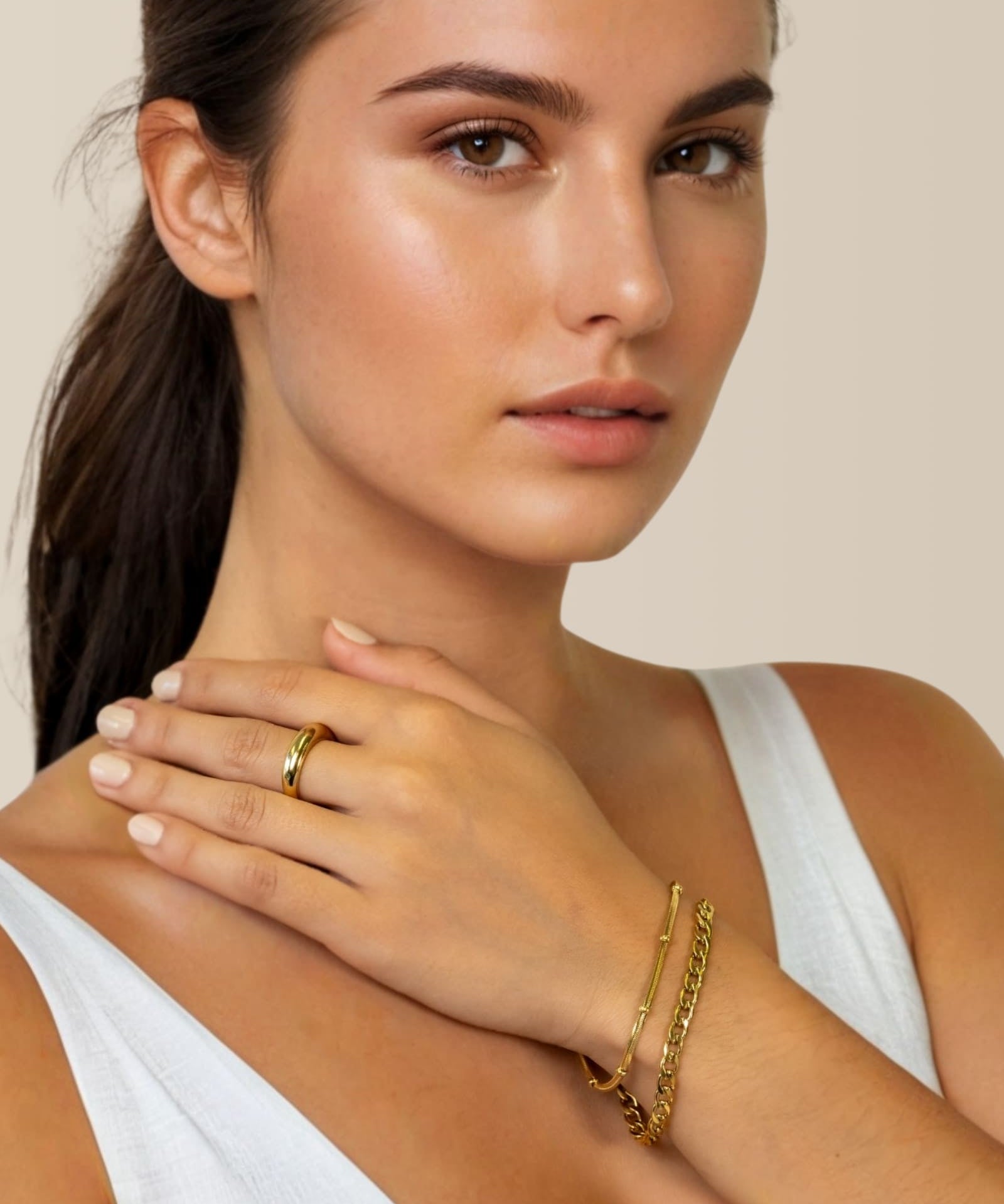 Cuban Duet Gold Bracelet Set by Lavana on model curb chain and smooth bar bracelet with bead accent