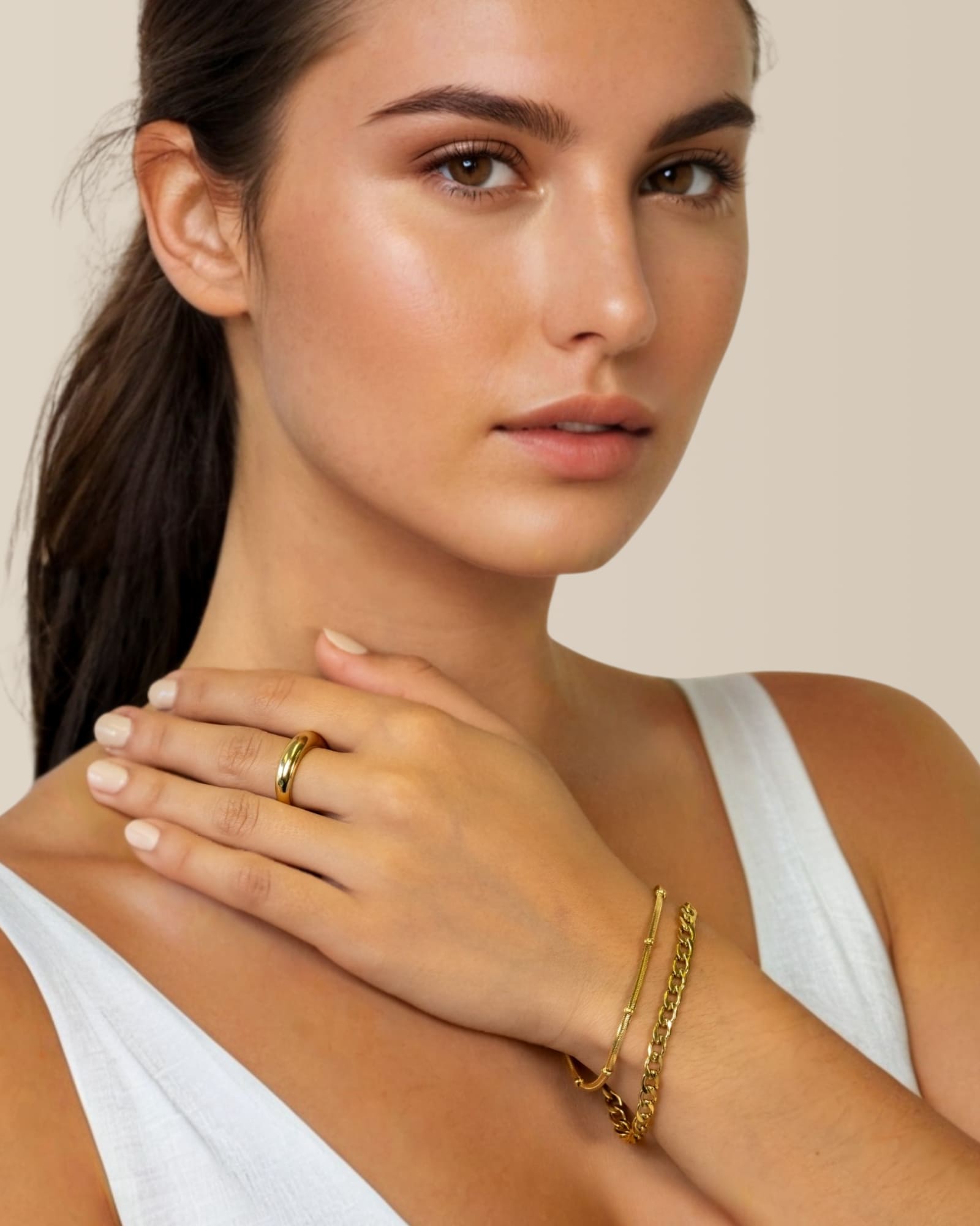 Cuban Duet Gold Bracelet Set by Lavana on model curb chain and smooth bar bracelet with bead accent