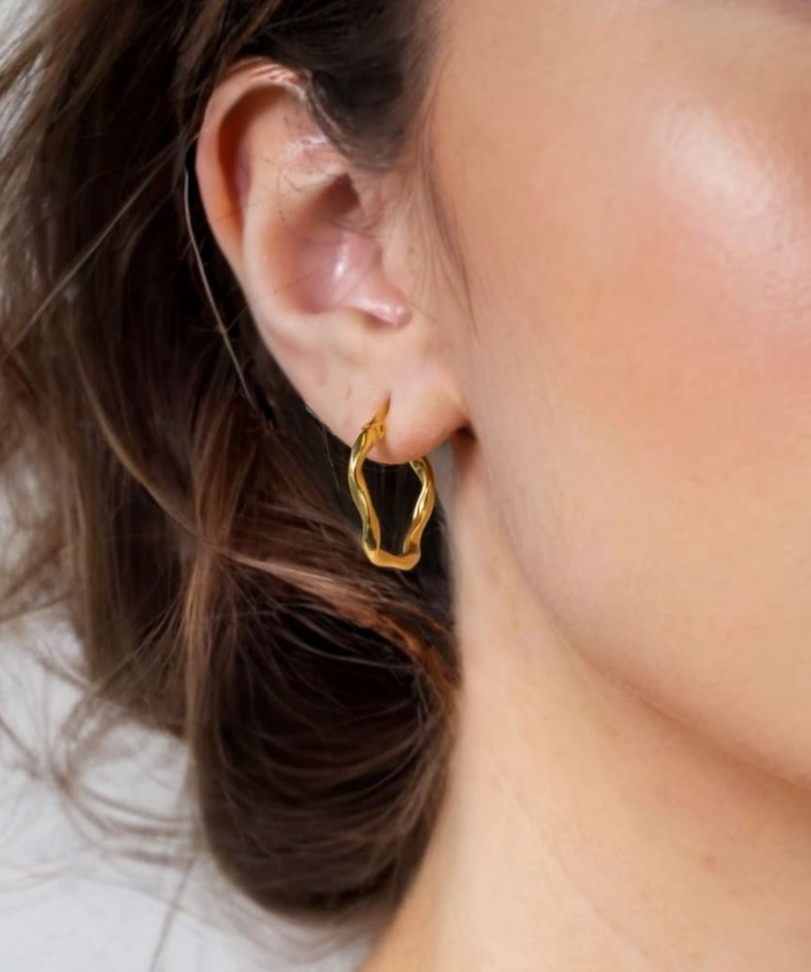 Dance Gold Hoop Earrings Medium by Lavana on model slim ribbon twist hoop with polished finish