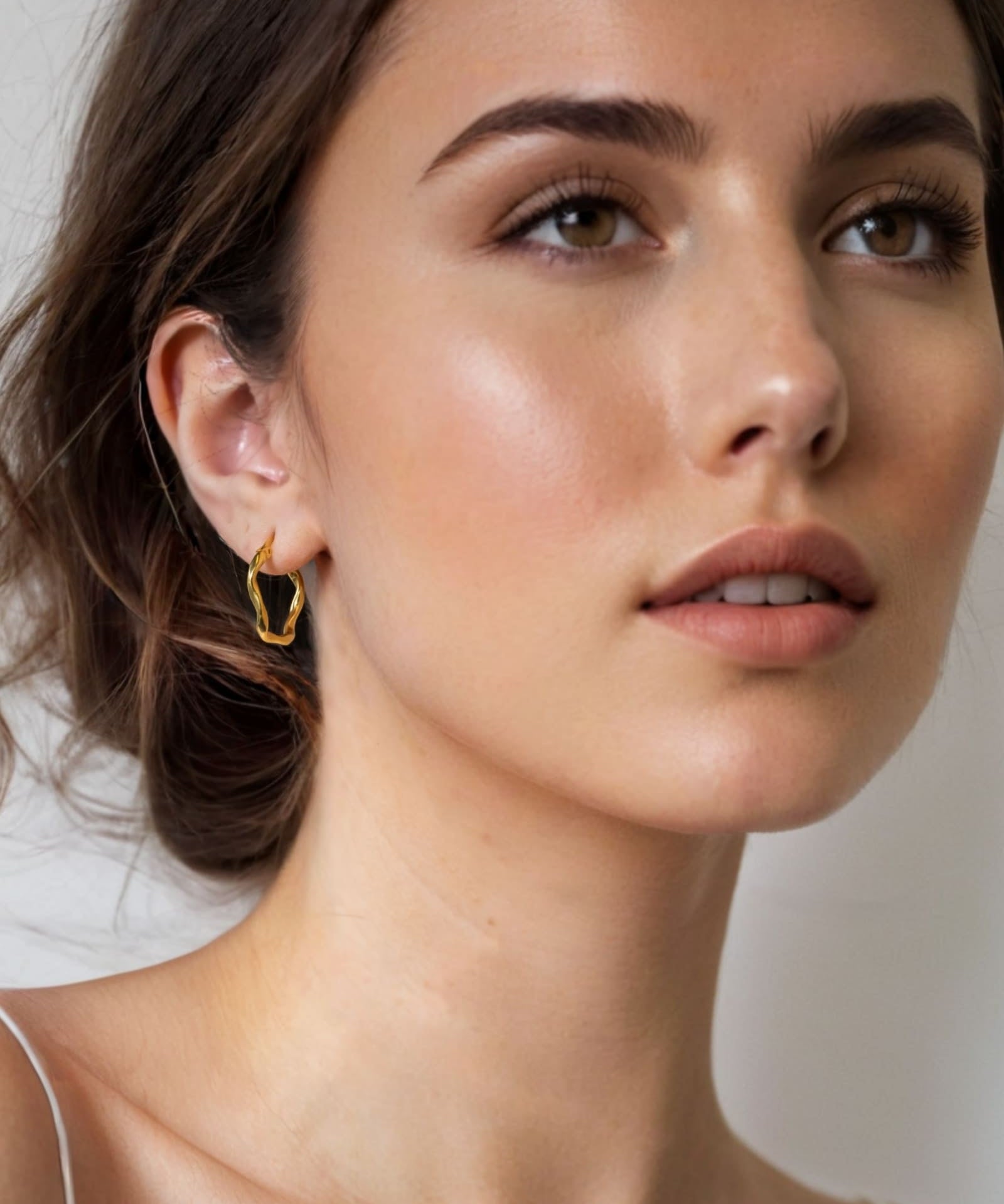 Dance Gold Hoop Earrings Medium by Lavana on model slim ribbon twist hoop with polished finish