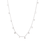 Dancing Discs Silver Chain Necklace by Lavana, fine chain with scattered polished discs, angled view