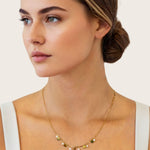 Dancing Discs Tango Gold Chain Necklace by Lavana, on model; chain with alternating discs and freshwater pearls