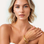 Disco Mesh Gold Cuff Bracelet by Lavana, on model; Twisty mesh surface with polished finish