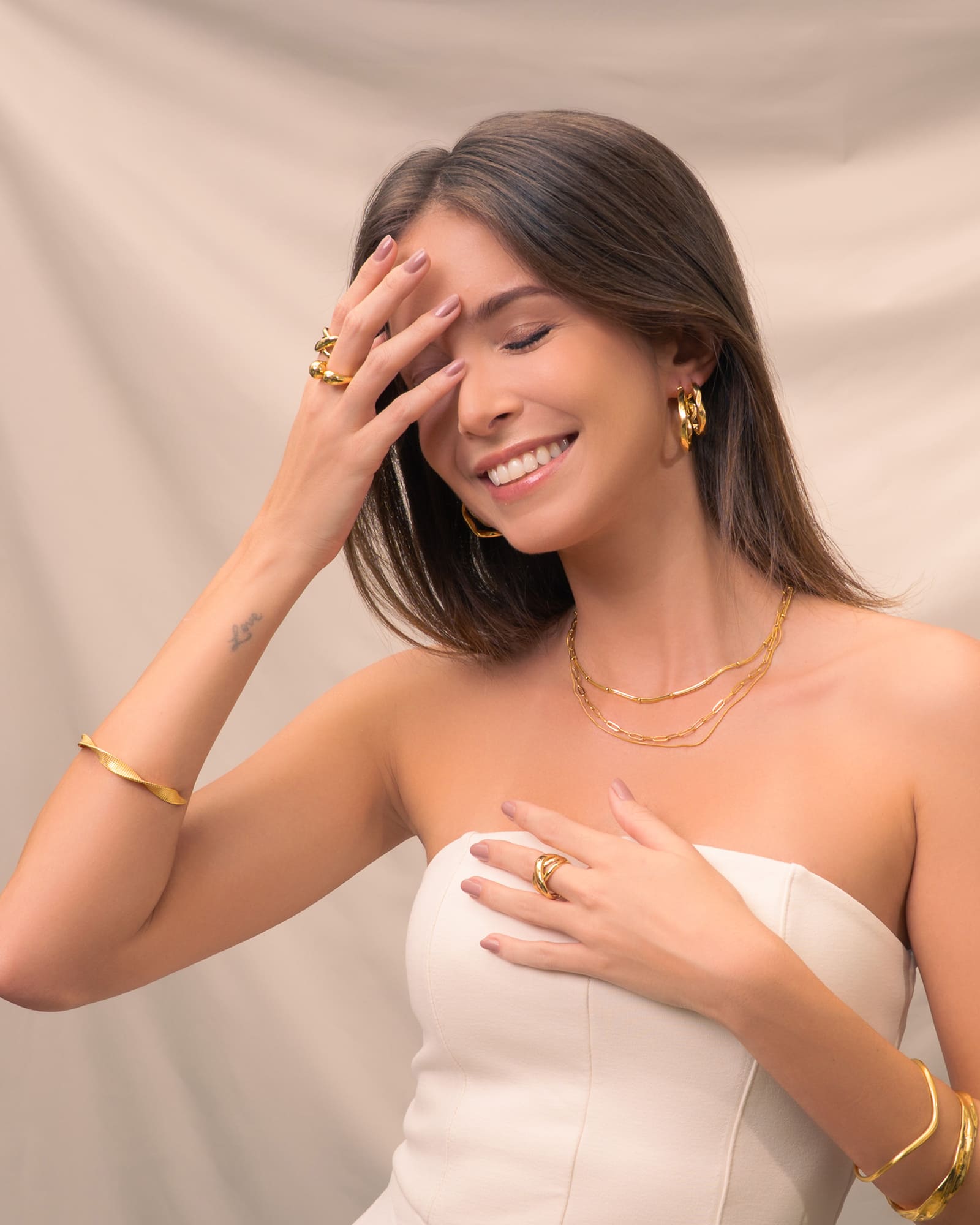 Disco Mesh Gold Cuff Bracelet by Lavana, on model; modern Twisty mesh surface with polished finish