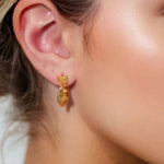 Disco Mesh Gold Hoop Earrings by Lavana on model twisty mesh texture with polished shine