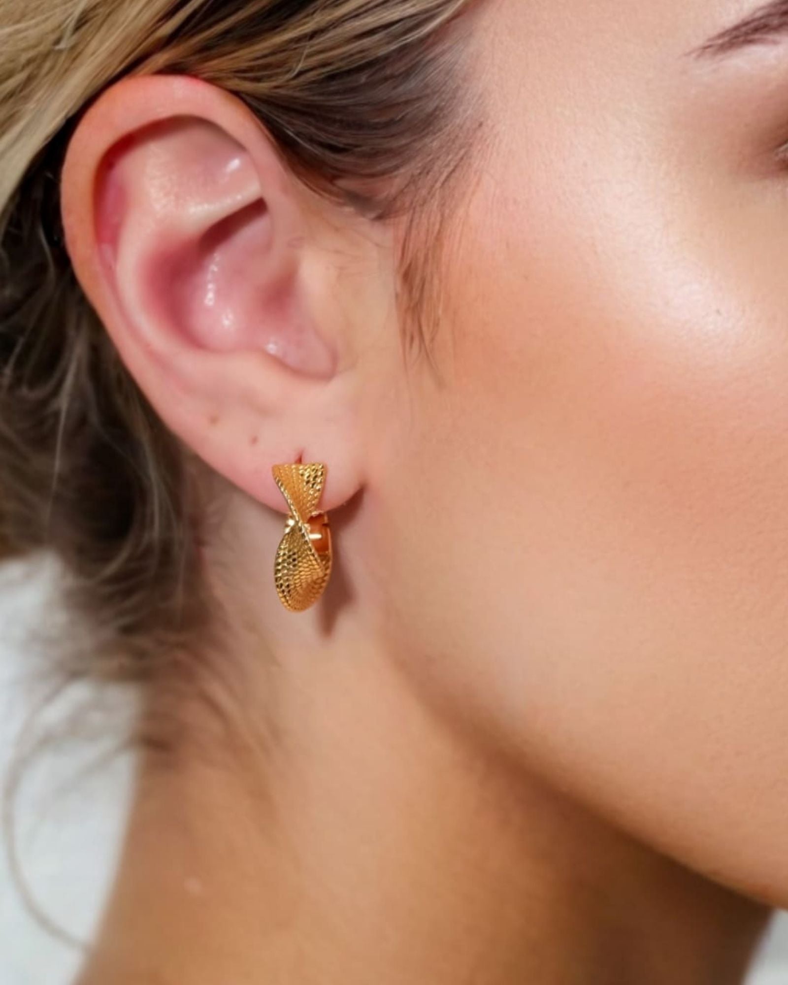 Disco Mesh Gold Hoop Earrings by Lavana on model twisty mesh texture with polished shine