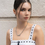 Dome Hoop Silver Huggie Earrings by LAVANA, on model; with smooth dome shine and close fit dress hoops