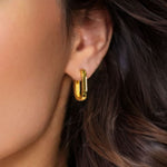 Ellipse Gold Hoop Earrings by Lavana on model slim oblong hinged hoops