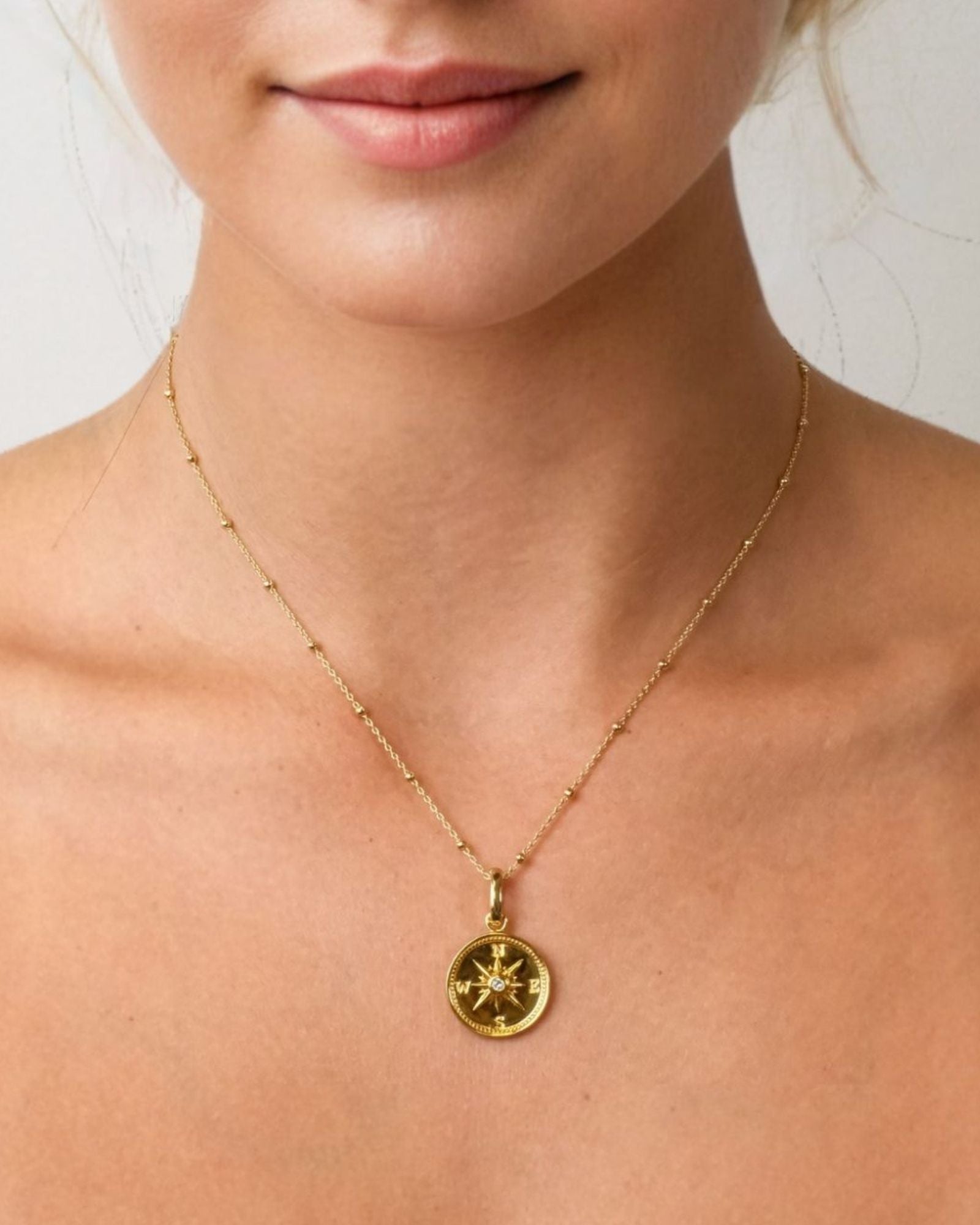 Exploration Compass Diamond Pendant by LAVANA on model in 18k gold plated sterling silver