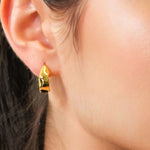 Fluidity Gold Hoop Earrings by LAVANA on model with polished organic ripple