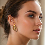 Formation Gold Hoop Earrings by Lavana on model sculpted full hoops with light textured contours