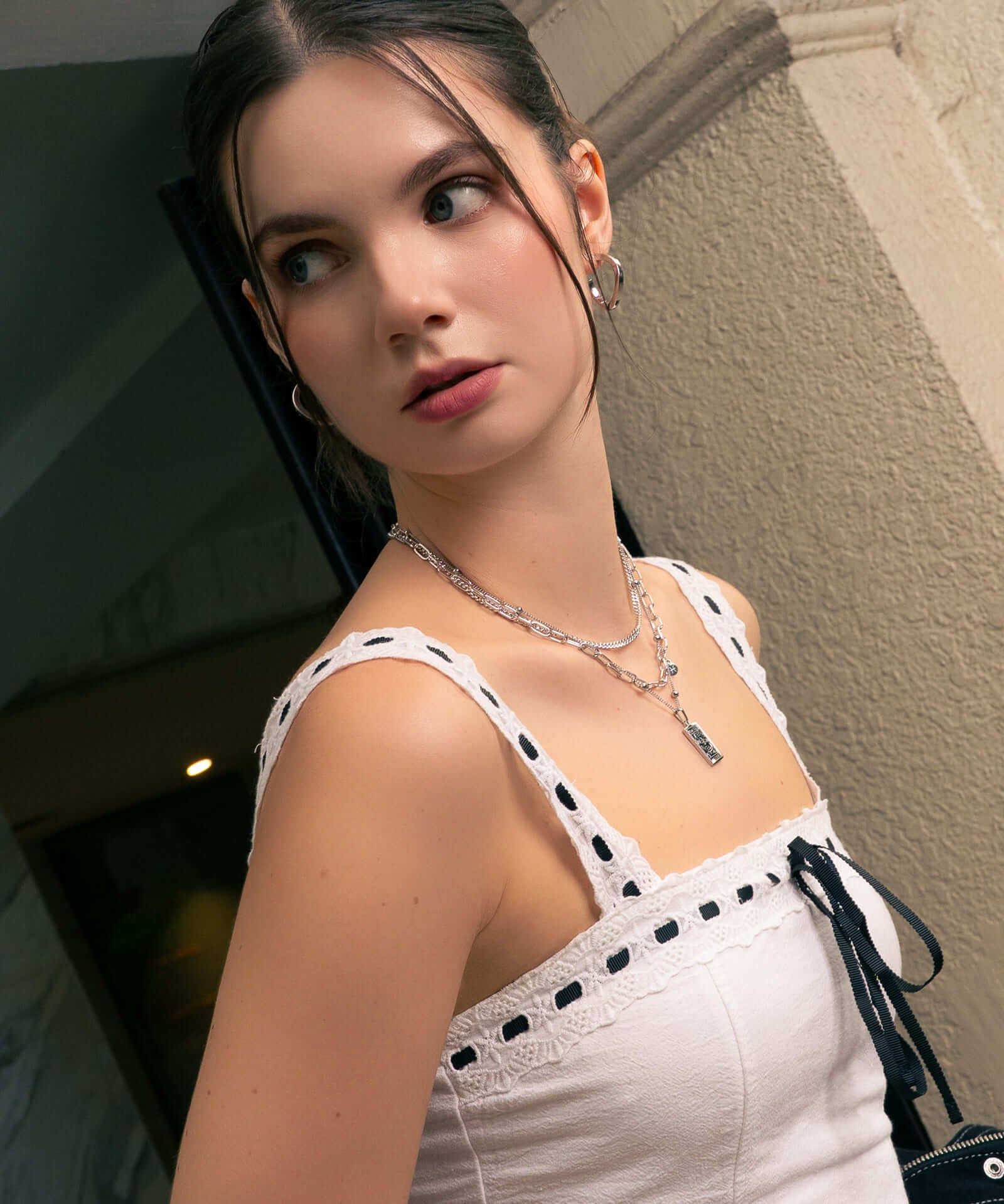 Formation Silver Hoop Earrings by LAVANA, on model; sculpted dress hoops  with subtle textured shape